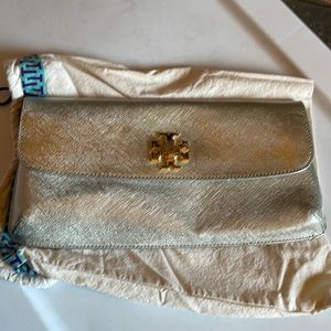 Beautiful silver Tory Burch clutch with gold closure